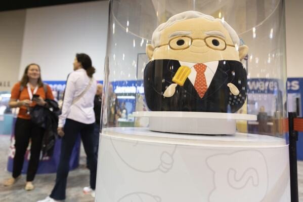 The Squishmallows booth sells toys modeled after Warren Buffett, pictured, and Charlie Munger in the exhibit hall for the Berkshire Hathaway annual meeting, Saturday, May 6, 2023, in Omaha, Neb.