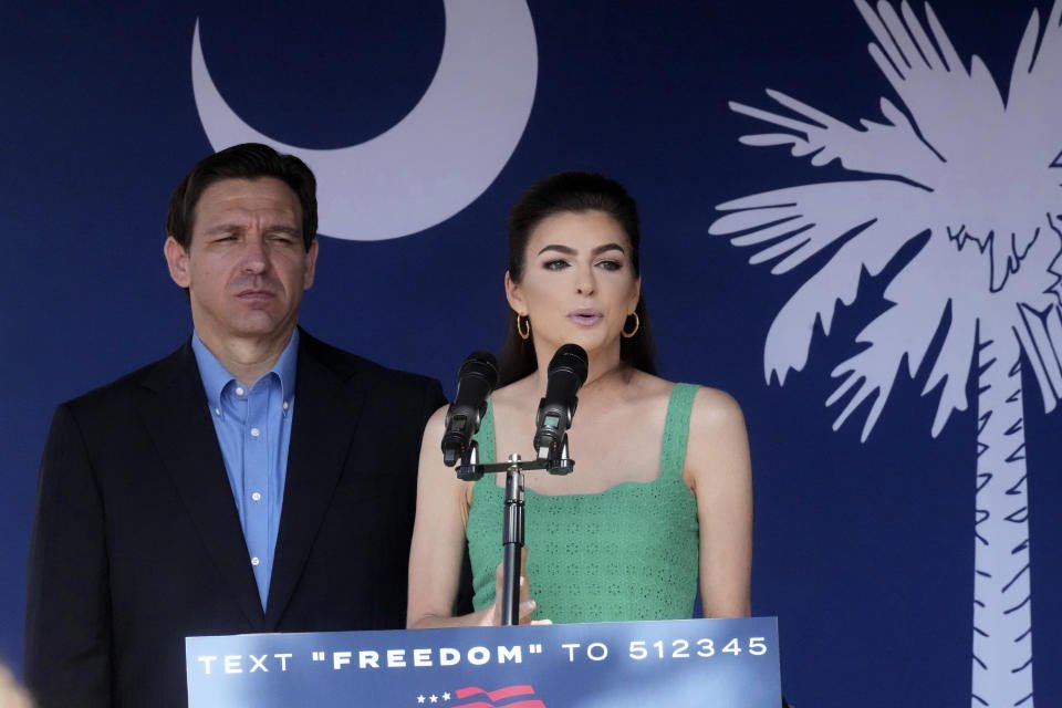 Florida Gov. Ron DeSantis, left, looks on as his wife Casey DeSantis speaks at a campaign event in Bluffton, S.C., June 2, 2023.