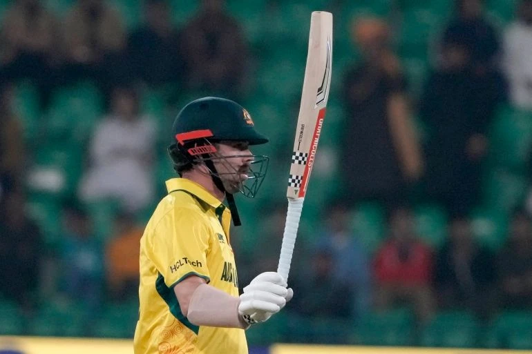 Australia's Travis Head celebrates after scoring fifty during the ICC Champions Trophy cricket match between Australia and Afghanistan, in Lahore, Pakistan, Friday, Feb. 28, 2025. (AP Photo/K.M. Chaudary)