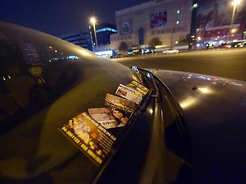 Picture for illustrative purposes: Massage cards on a car in Dubai