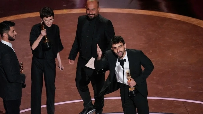 (From L to R) Basel Adra Rachel Szor, Hamdan Ballal, Yuval Abraham accept the award for best documentary feature film for No Other Land. (Photo: AP)