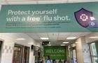 Sign at entrance of Publix grocery store advertising Flu Shot services, Palm Beach, Florida