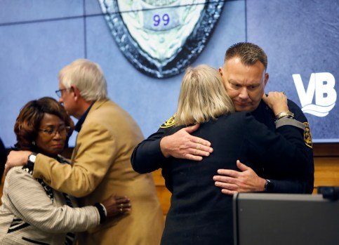 Virginia Beach officials, including Sheriff Rocky Holcomb, comfort each other following a press conference about Friday night’s shooting deaths of two Virginia Beach police officers. As seen Saturday, Feb. 22, 2025. (Stephen M. Katz / The Virginian-Pilot)