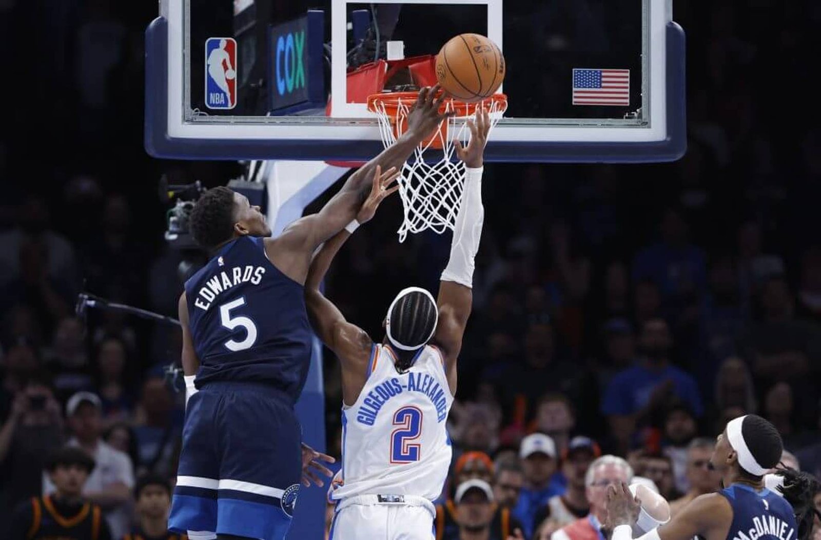 Feb 24, 2025; Oklahoma City, Oklahoma, USA; Minnesota Timberwolves guard Anthony Edwards (5) blocks a shot by Oklahoma City Thunder guard Shai Gilgeous-Alexander (2) during the second half at Paycom Center.