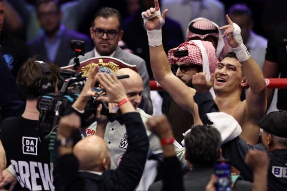 Boxing - Light Heavy Championship - Artur Beterbiev v Dmitrii Bivol - anb Arena, Riyadh, Saudi Arabia - February 23, 2025 Dmitrii Bivol celebrates after winning his fight against Artur Beterbiev REUTERS/Hamad I Mohammed