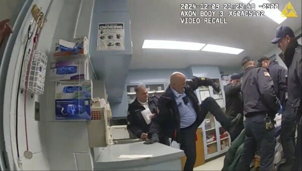 This image provided by the New York State Attorney General office shows body camera footage of correction officers beating a handcuffed man, Robert Brooks, 43, at the Marcy Correctional Facility in Oneida County, N.Y., on Dec. 9, 2024.