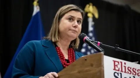 Getty Images Elissa Slotkin stands at a podium