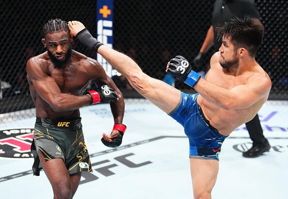 Henry Cejudo kicks Aljamain Sterling in the UFC bantamweight championship fight during the UFC 288 event at Prudential Center on May 06, 2023 in Newark, New Jersey.