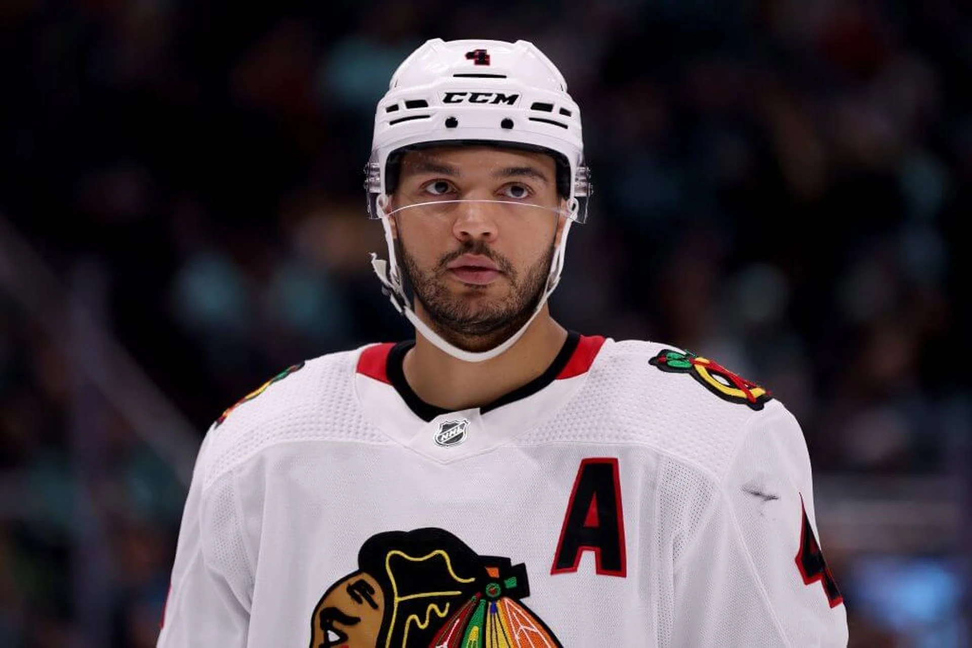 SEATTLE, WASHINGTON - APRIL 08: Seth Jones #4 of the Chicago Blackhawks looks on during the second period against the Seattle Kraken at Climate Pledge Arena on April 08, 2023 in Seattle, Washington. (Photo by Steph Chambers/Getty Images)