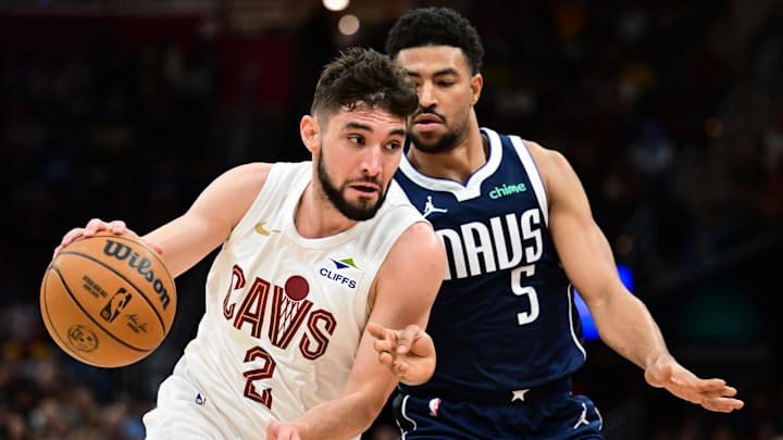 Feb 2, 2025; Cleveland, Ohio, USA; Cleveland Cavaliers guard Ty Jerome (2) drives to the basket against Dallas Mavericks guard Quentin Grimes (5) during the second half at Rocket Mortgage FieldHouse. Mandatory Credit: Ken Blaze-Imagn Images