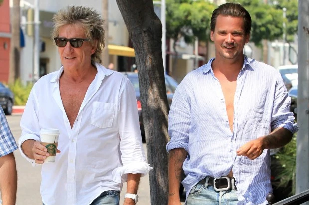 Rod Stewart and Sean Stewart walking down the street.