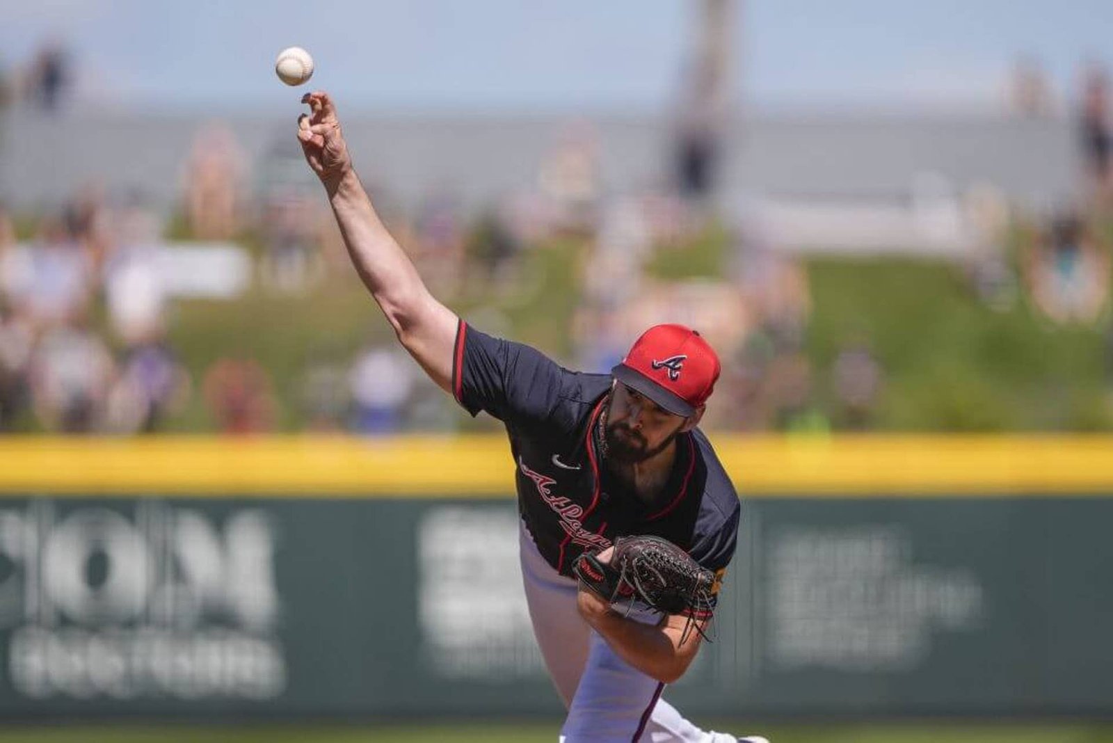 Atlanta Braves pitcher Ian Anderson delivers in the first inning of a spring training baseball game against the Tampa Bay Rays in North Port, Fla., Sunday, Feb. 23, 2025. (AP Photo/Gerald Herbert)