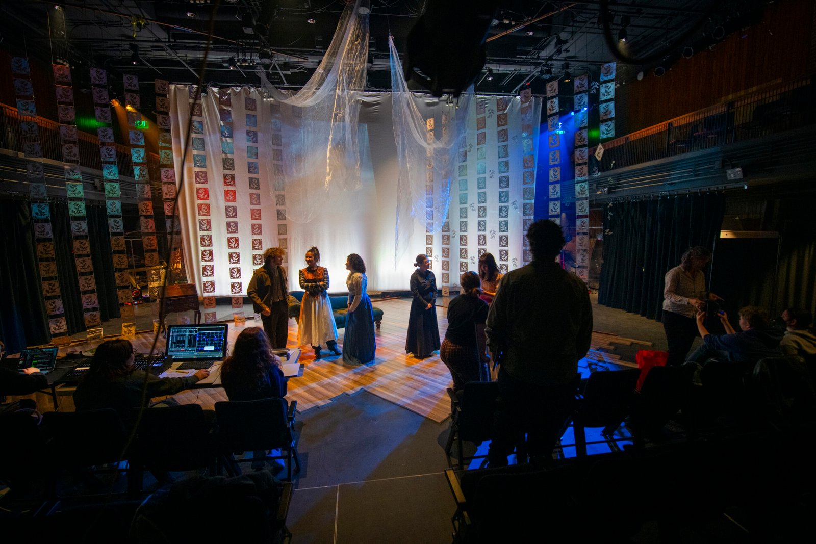 students rehearsing play on stage