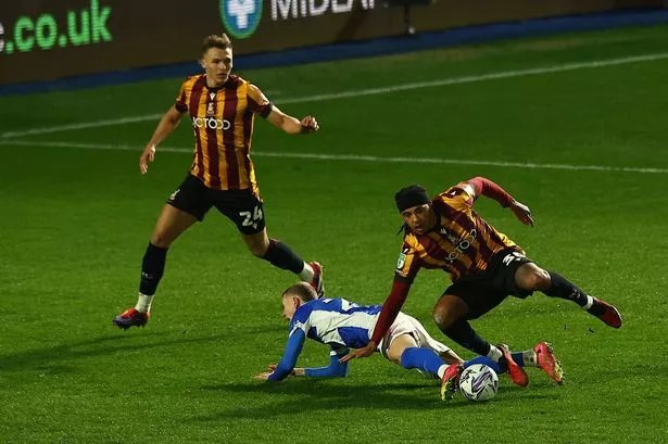 Jay Stansfield of Birmingham City is fouled by Romoney Crichlow of Bradford City -no penalty