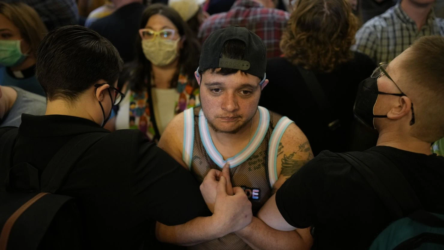 Protesters fill the Iowa state Capitol to denounce a bill that would strip the state civil rights code of protections based on gender identity, in Des Moines, Iowa, on Thursday.