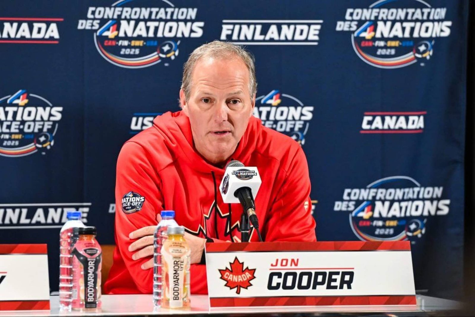 MONTREAL, CANADA - FEBRUARY 11:  Head coach Jon Cooper of Canada takes questions during media day ahead of the 2025 NHL 4 Nations Face-Off at the Bell Centre on February 11, 2025 in Montreal, Quebec, Canada.