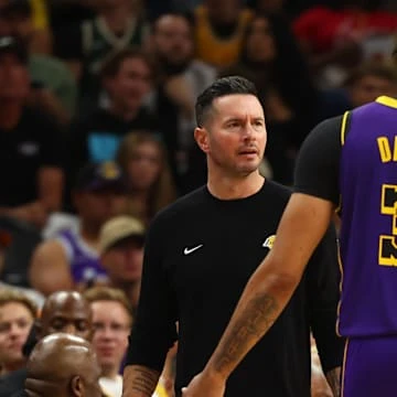 Oct 28, 2024; Phoenix, Arizona, USA; Los Angeles Lakers head coach JJ Redick with forward Anthony Davis (3) against the Phoenix Suns at Footprint Center. Mandatory Credit: Mark J. Rebilas-Imagn Images