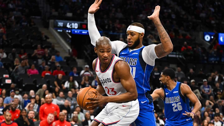 Oct 14, 2024; Inglewood, California, USA; LA Clippers forward Kai Jones (23) looks to pass against Dallas Mavericks center Daniel Gafford (21) during the first half at Intuit Dome. Mandatory Credit: Jonathan Hui-Imagn Images