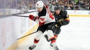 New Jersey Devils centre Jack Hughes (86) and Vegas Golden Knights center Jack Eichel (9) battle for the puck during the first period of an NHL hockey game Sunday, March 2, 2025, in Las Vegas. (Ian Maule/AP)