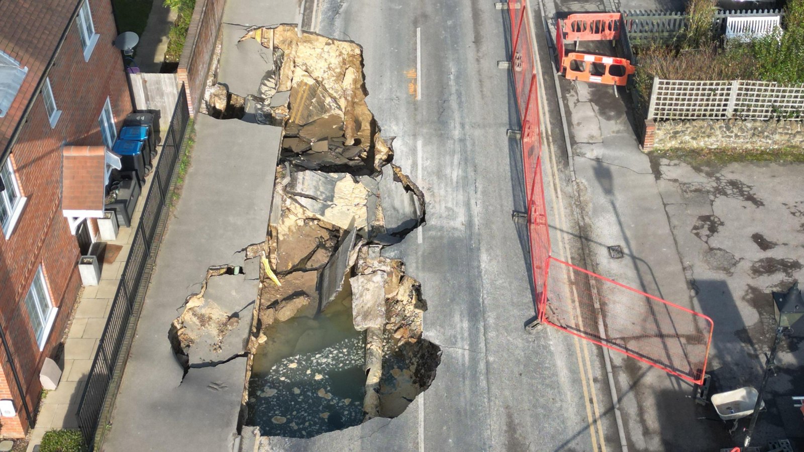 A drone image showing a large part of the road that has collapsed into the sinkhole.