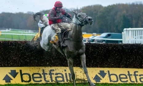 Grey Dawning clears a hurdle in the Betfair Chase at Haydock in November 2024