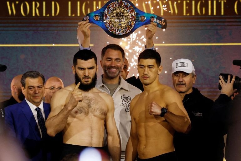 Boxing - Light Heavy Championship - Artur Beterbiev v Dmitrii Bivol - Weigh-In - Boulevard City, Riyadh, Saudi Arabia - February 21, 2025 Artur Beterbiev and Dmitrii Bivol during the Weigh-In as promoter Eddie Hearn looks on REUTERS/Hamad I Mohammed TPX IMAGES OF THE DAY