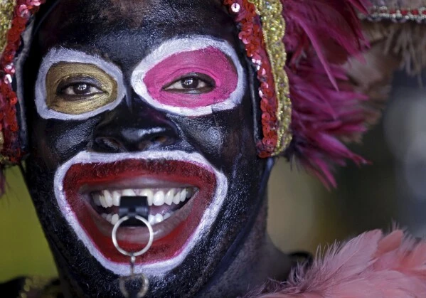 Maurice Lightfoot, a member of 'The Tramps,' the oldest unit of the Zulu Social Aid and Pleasure Club, a historic New Orleans Mardi Gras krewe, participates in King's Day festivities in New Orleans, Jan. 6, 2015. (AP Photo/Gerald Herbert, File)