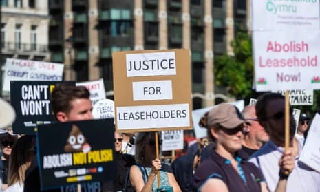 People with placards at a leaseholders’ rally in London.