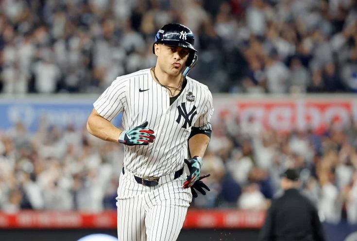 Giancarlo Stanton #27 of the New York Yankees rounds the bases on his solo home run during the third inning of Game 5 of the World Series.