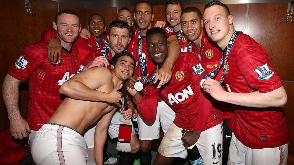 Danny Welbeck (centre front, showing off his medal) won the 2012-13 Premier League title with Manchester United