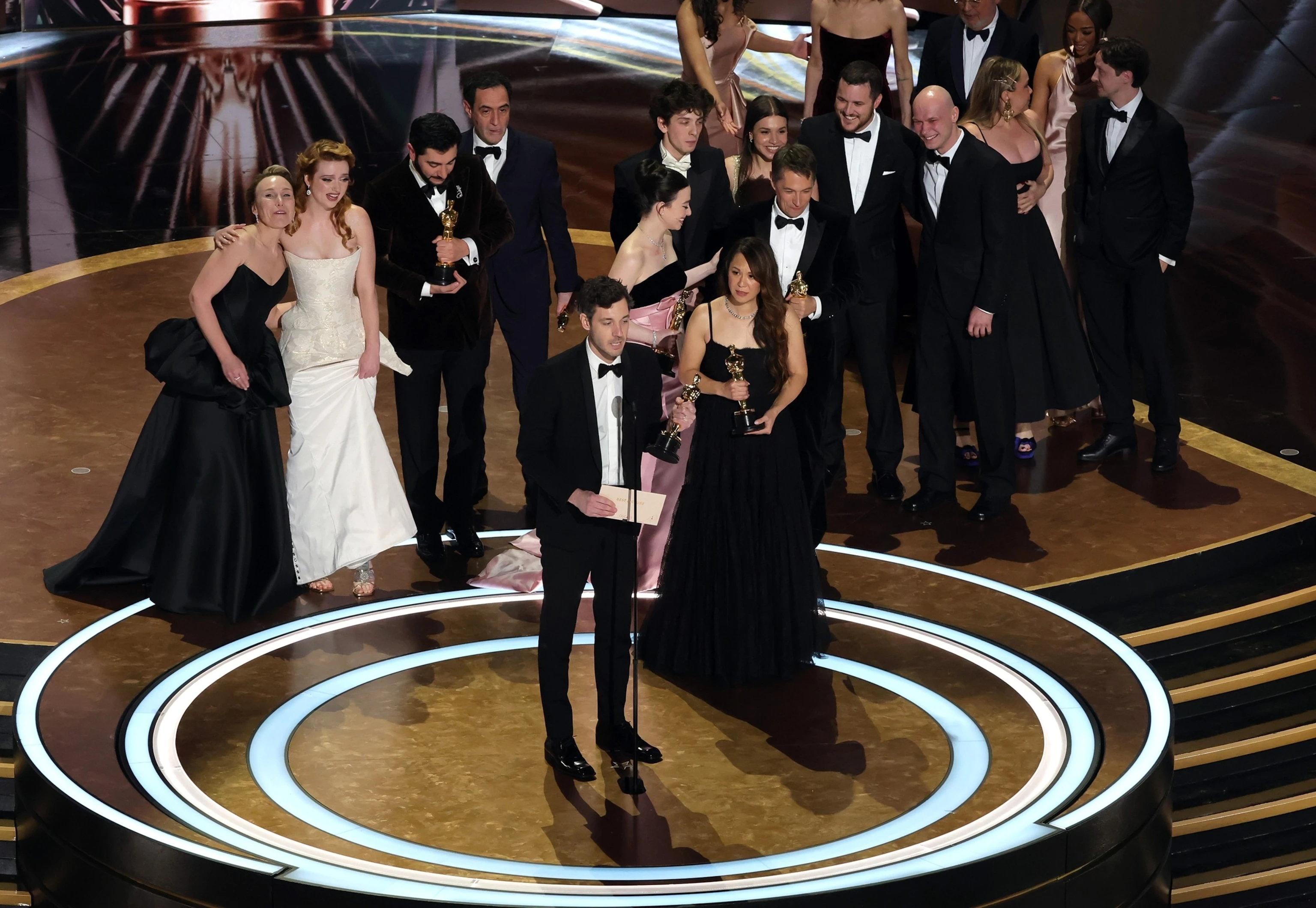 PHOTO: Cast and crew accept the Best Picture award for "Anora" onstage during the 97th Annual Oscars at Dolby Theatre, on March 2, 2025, in Hollywood, Calif.