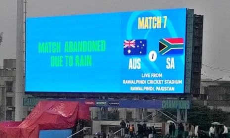 The scoreboard in Rawalpindi displays the message: 'Match abandoned due to rain' alongside Australia and South Africa flags