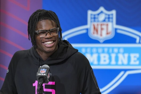 Colorado defensive back Travis Hunter speaks during a press conference at the NFL football scouting combine in Indianapolis, Thursday, Feb. 27, 2025. (AP Photo/Michael Conroy)