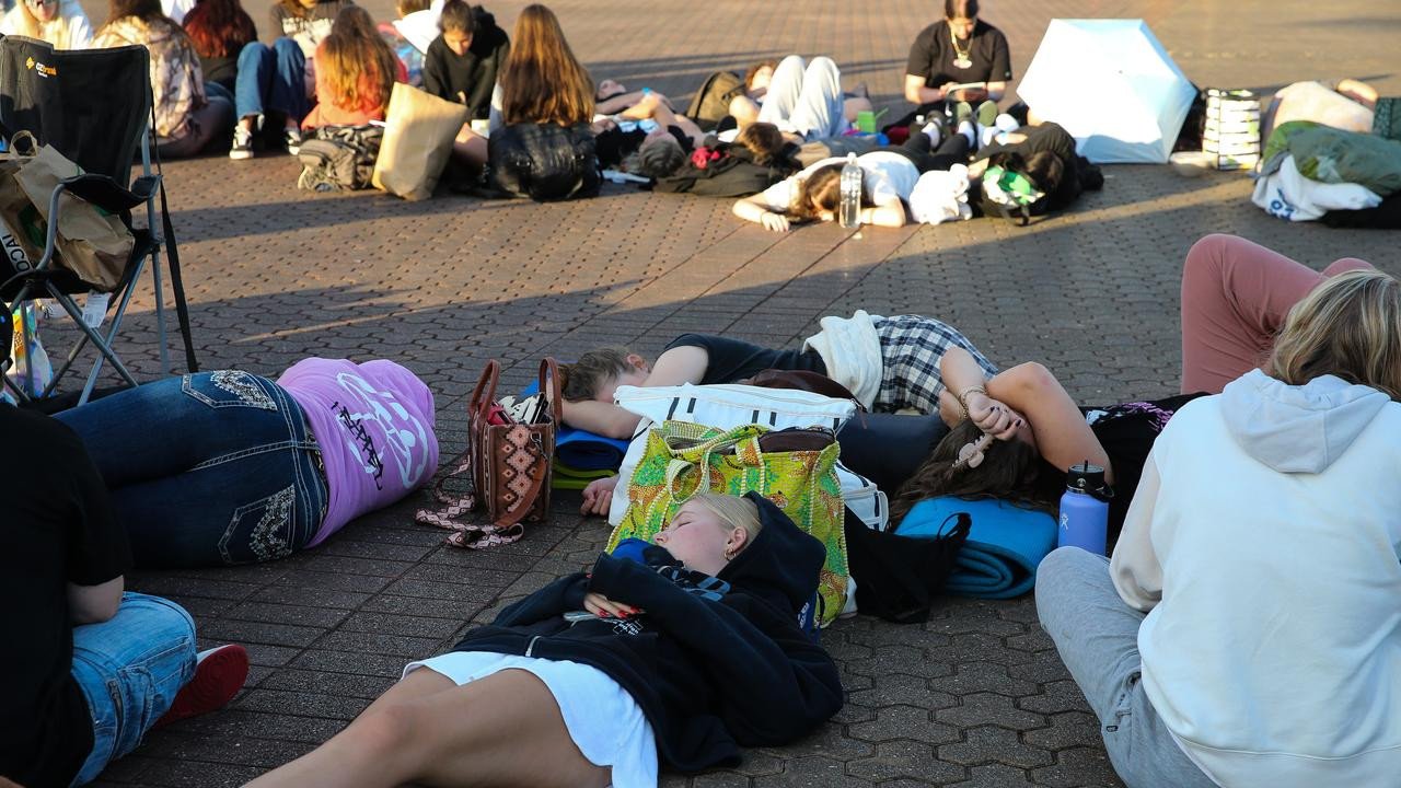 Fans are seen sleeping on the ground early on Monday Olympic park in Sydney. Picture: NewsWire/ Gaye Gerard