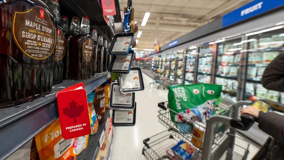 A customer buys Canadian-made maple syrup at the Real Canadian Superstore, Mar. 3, 2025 in Toronto, Canada, a scene that may become less common as tariffs take effect, potentially raising prices for consumers and disrupting trade relationships between the U.S. and its largest trading partners, as captured by Katherine Ky Cheng/Getty Images.