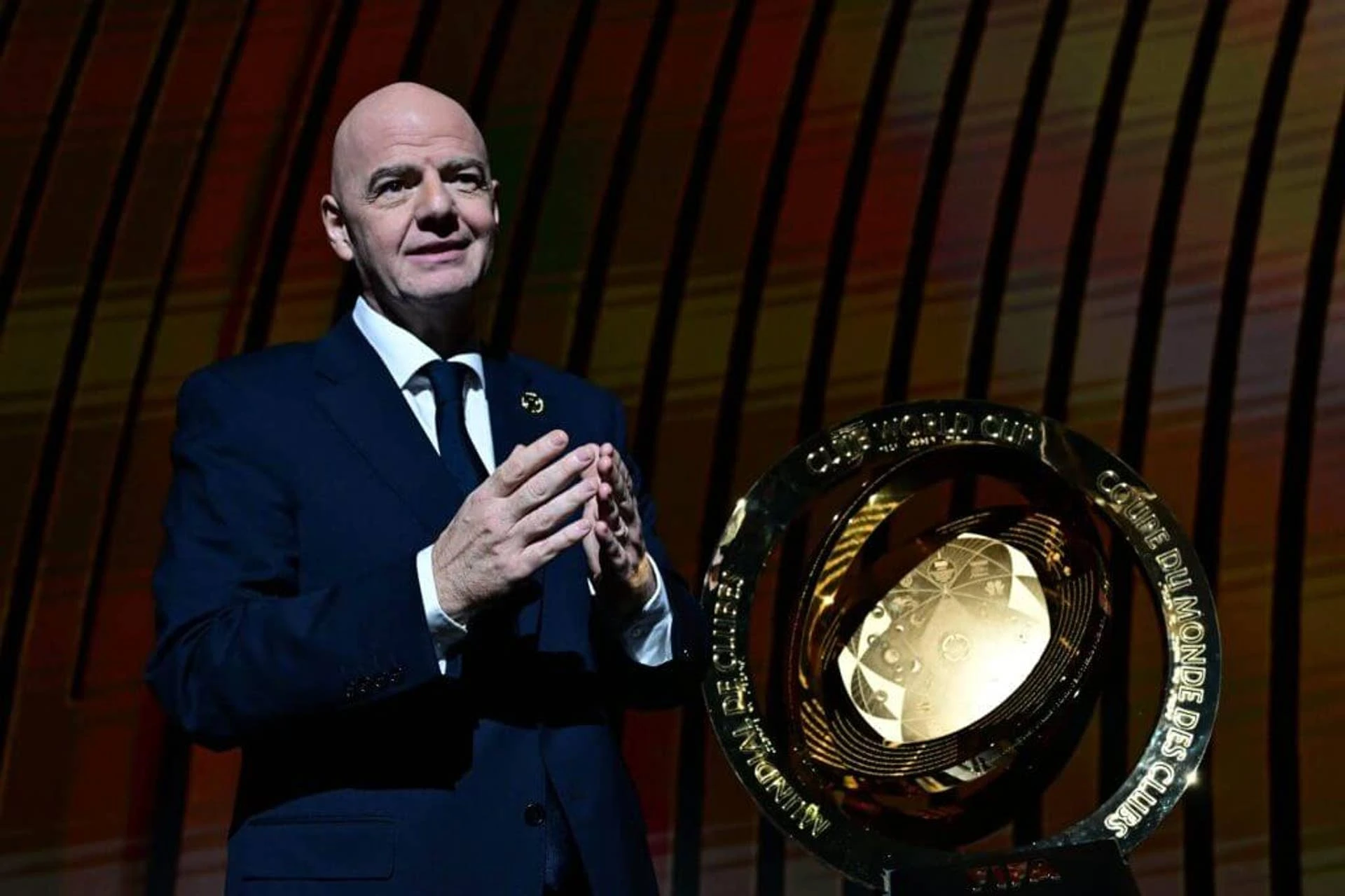 President of FIFA Gianni Infantino speaks next to the trophy during the 2025 FIFA Club World Cup Draw ceremony in Miami on December 5, 2024. (Photo by Giorgio VIERA / AFP) (Photo by GIORGIO VIERA/AFP via Getty Images)