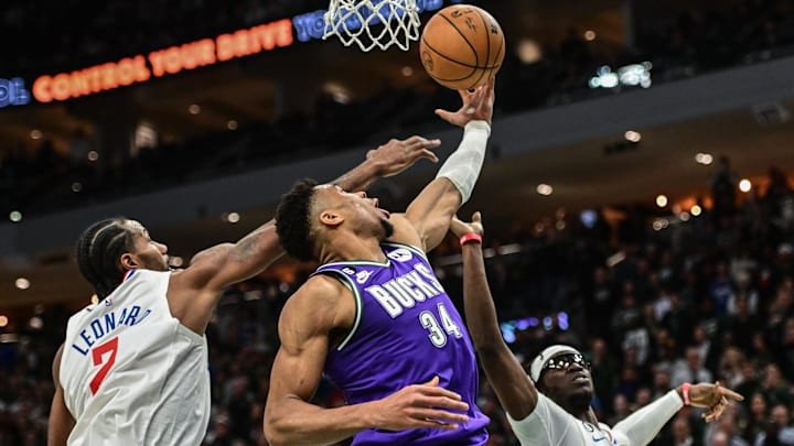 Feb 2, 2023; Milwaukee, Wisconsin, USA; Milwaukee Bucks forward Giannis Antetokounmpo (34) takes a shot against Los Angeles Clippers guard Kawhi Leonard (2) in the fourth quarter at Fiserv Forum. Mandatory Credit: Benny Sieu-Imagn Images