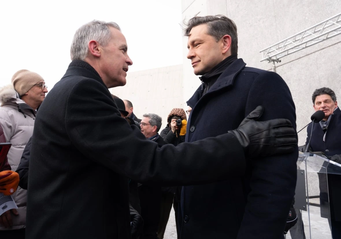 Liberal Leadership candidate Mark Carney speaks with Conservative Leader Pierre Poilievre before a ceremony at the National Holocaust Monument, Monday, Jan 27, 2025 in Ottawa.