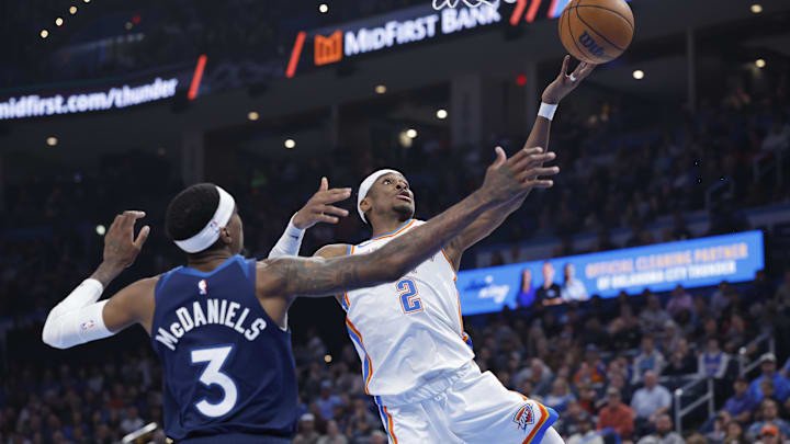 Oklahoma City Thunder guard Shai Gilgeous-Alexander shoots as Minnesota Timberwolves forward Jaden McDaniels defends during the second quarter at Paycom Center in Oklahoma City on Feb. 24, 2025.