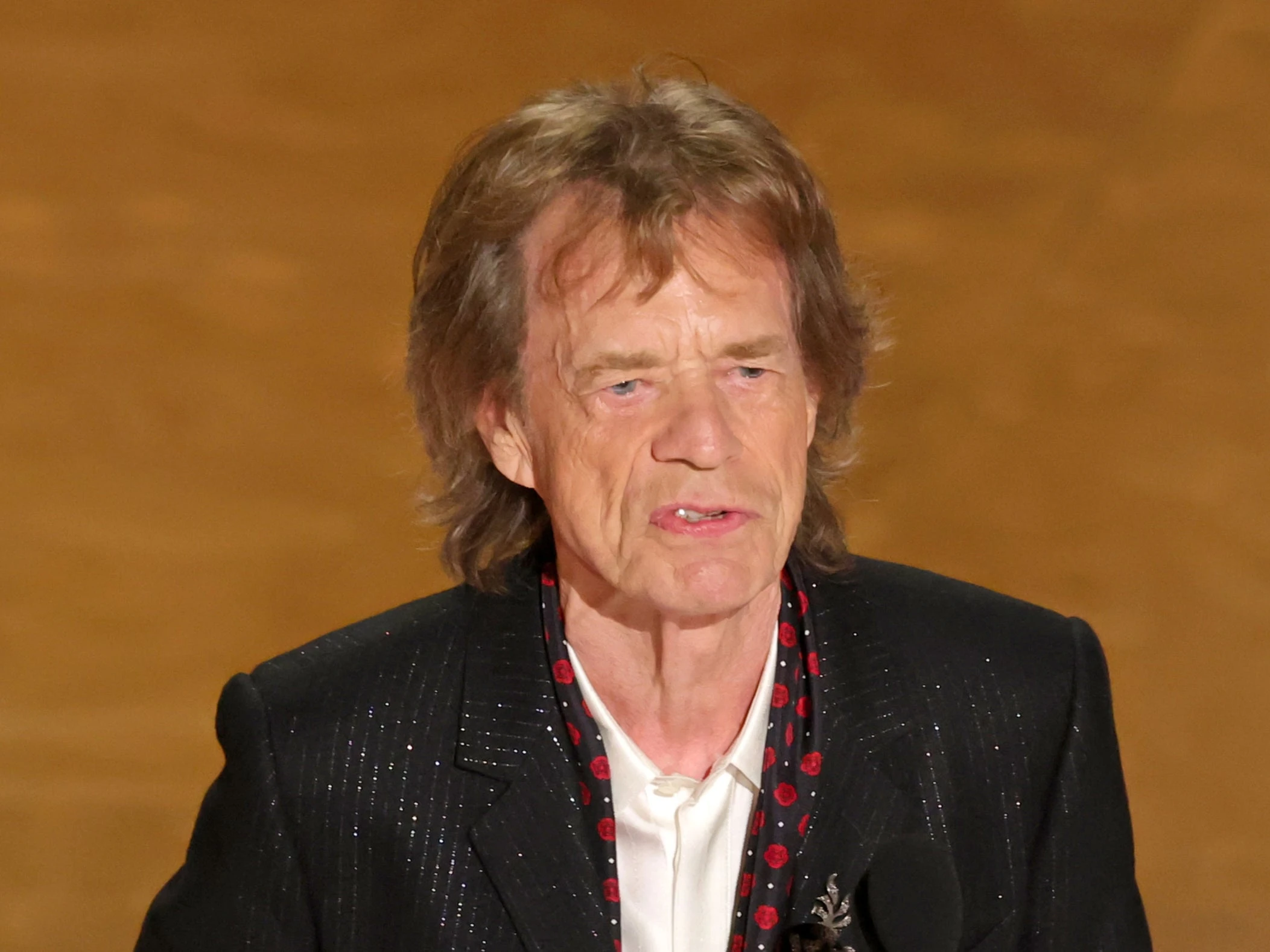 Mick Jagger was a surprise attendee at the 2025 Oscars and talked about the academy losing its first choice - Bob Dylan