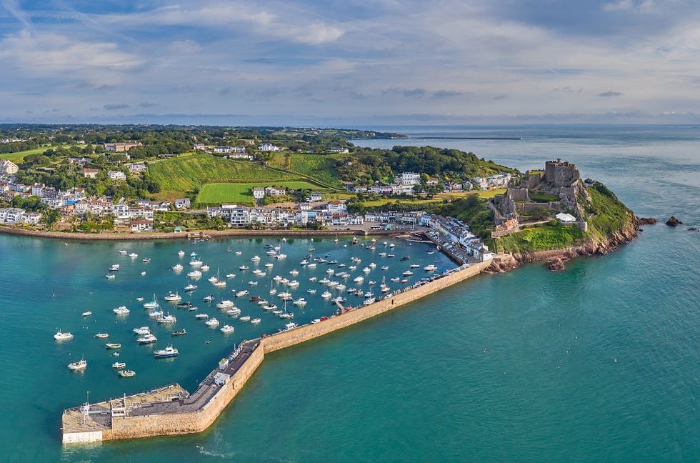 drone aerial view of gorey harbour at high tide jersey is a popular holidayvacation destination as well as an international finance center jersey, channel islands