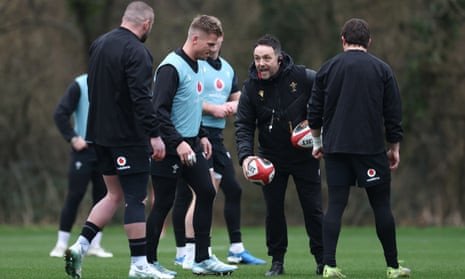 Matt Sherratt (centre), the interim head coach of Wales, talks to his players during a training session n Cardiff.