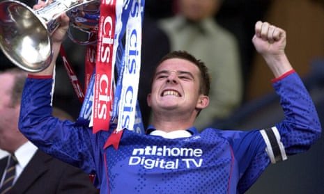 Rangers captain Barry Ferguson celebrates with the CIS Insurance Cup after beating Celtic in 2003