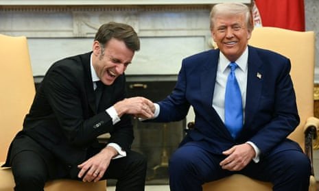 Macron and Trump laughing while shaking hands