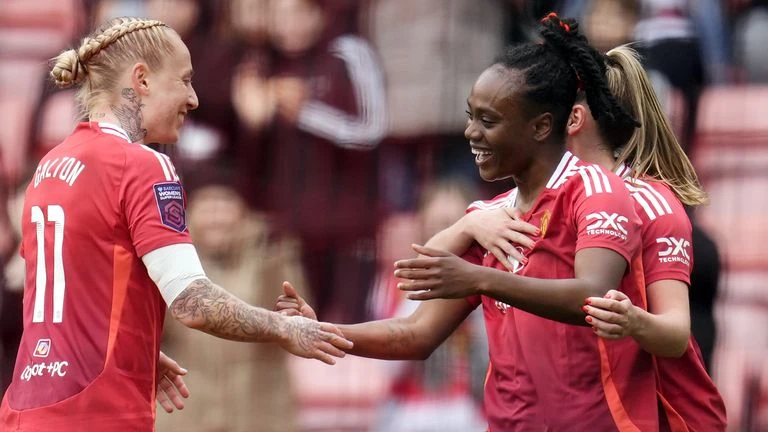 Manchester United's Melvine Malard celebrates her goal