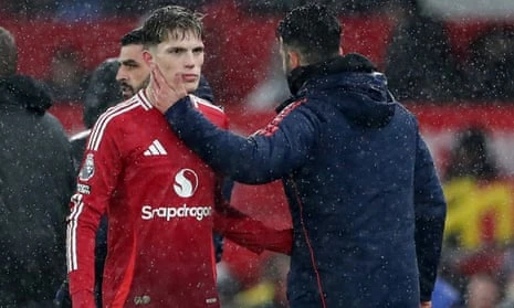 Alejandro Garnacho is consoled by Ruben Amorim as he is substituted before half-time.