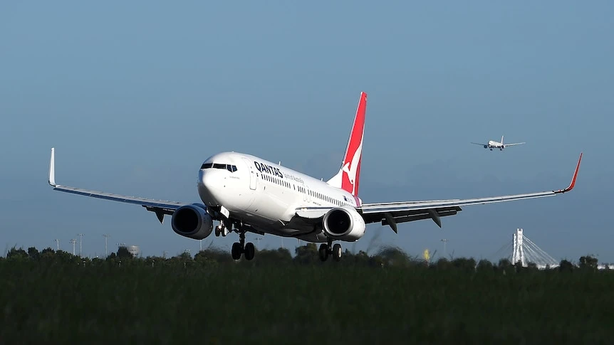 A Qantas Boeing 737-800 aircraft is seen landing at Sydney Domestic Airport