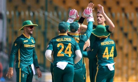 Marco Jansen (top right) celebrates with his South Africa teammates after taking the wicket of England's Phil Salt.