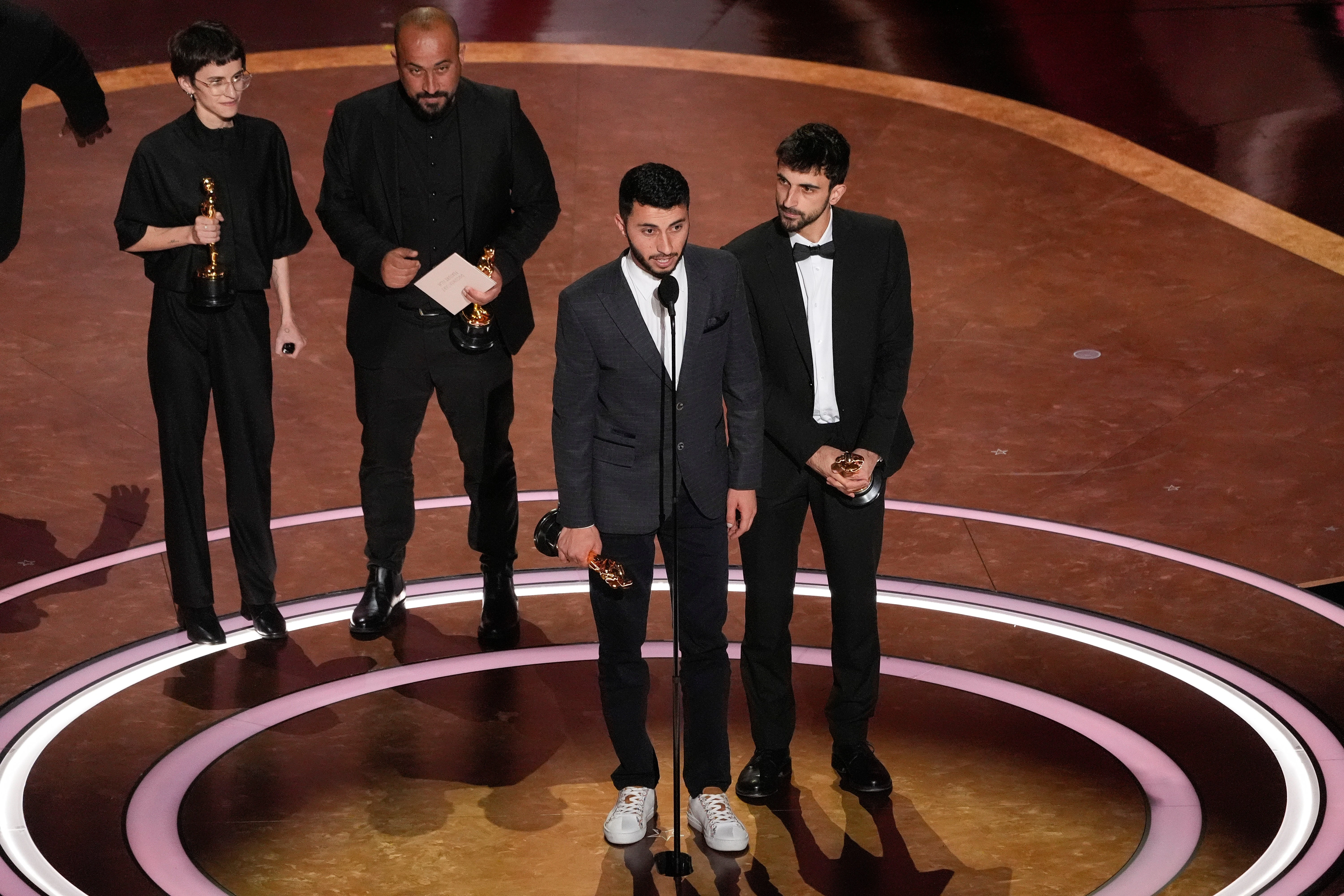 Basel Adra (center), a Palestinian activist, and Yuval Abraham (right), an Israeli investigative journalist, won the best documentary film Oscar for their film No Other Land