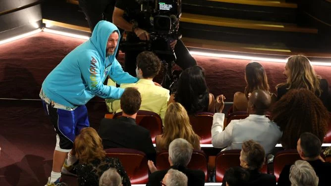 Adam Sandler, Timothée Chalamet, and Kylie Jenner are seen during the 97th Annual Oscars at Dolby Theatre.